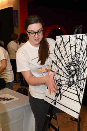 a woman explaining perpective and how the brain sees an image at differnt points along perspective drawing