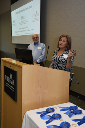 A woman presenting at a lecturn