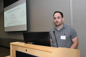 A man making a presentation at the lecturn