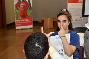 a man doing perceprtion experiments with a female teenager